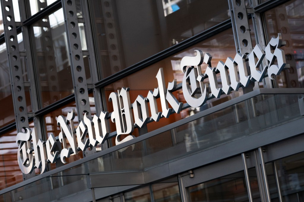 The sign for The New York Times hangs over the entrance to its building in New York, taken on May 6, 2021.